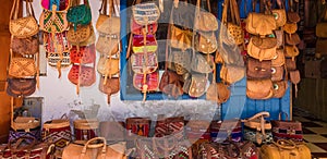 Moroccan leather goods bags in a row at outdoor market