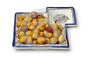 Moroccan pickled olives on a ceramic olive dish