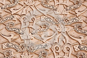 Moroccan stucco ornaments, in the Medersa-ben-Youssef a historical Koranic School in Marrakech, Morocco photo