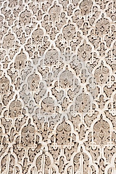 Moroccan stucco ornaments, in the Medersa-ben-Youssef a historical Koranic School in Marrakech photo