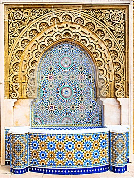 Moroccan style fountain with fine colorful mosaic tiles at the Mohammed V mausoleum in Rabat Morocco