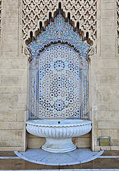 Moroccan style fountain with fine colorful mosaic tiles at the Mohammed V mausoleum in Rabat Morocco