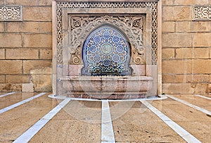 Moroccan style fountain with fine colorful mosaic tiles at the Mohammed V mausoleum in Rabat Morocco