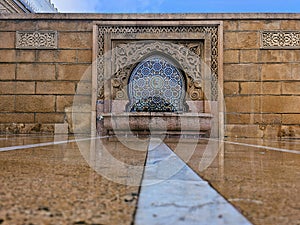 Moroccan style fountain with fine colorful mosaic tiles at the Mohammed V mausoleum in Rabat Morocco