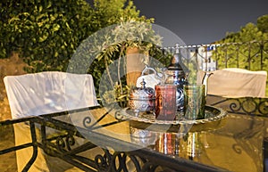 Moroccan tea party set up in a warm oriental candlelights atmosphere