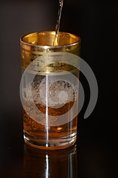 Moroccan Tea Poured into Glass