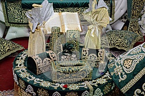 Moroccan Tyafer, traditional gift containers for the wedding ceremony, decorated with ornate golden embroidery.Moroccan henna .