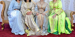 Moroccan women wearing the royal caftan. Moroccan wedding guests photo