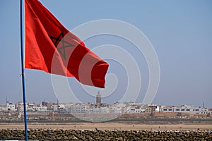 Morocco flag on Casablanca cityscape background