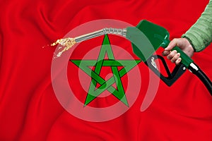 MOROCCO flag Close-up shot on waving background texture with Fuel pump nozzle in hand. The concept of design solutions. 3d