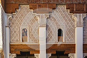 Morocco. Marrakesh. Tourists at the windows of the Medersa Ben Youssef. The largest and most important madrassa in Morocco