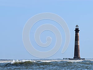 Morris Island Lighthouse with waves Folly Beach SC