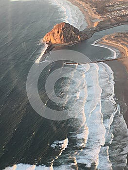 Morro Bay aerial photo at sunset - illuminated rock by sunset