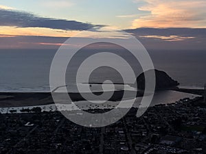 Morro Bay aerial photo at sunset with tall ships entering harbor