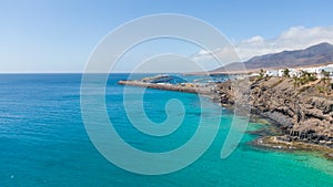 Morro Jable Canary Island, Fuerteventura Spain, Aerial view on coast of atlantic ocean and beach, Drone shot of sea