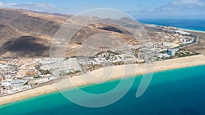 Morro Jable Canary Island, Fuerteventura Spain, Aerial view on coast of atlantic ocean and beach, Drone shot of sea