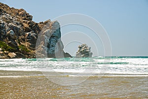 Morro Rock on the beach, sunny day at Morro Bay State Park, California