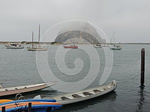 Morro Rock in California with boats in the water.