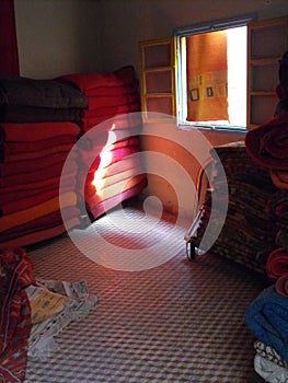 Oriental carpet shop interior with open window