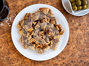 Morros fritos - traditional Spanish meat appetizer served on plate photo