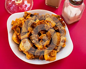 Morros fritos - traditional Spanish meat appetizer served on plate photo