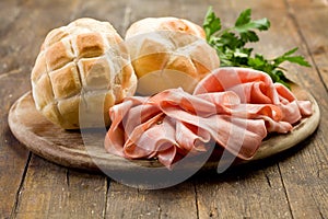 Mortadella with Bread on Chopping board