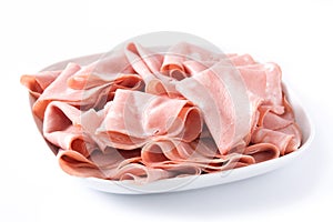 Mortadella slices on white plate isolated