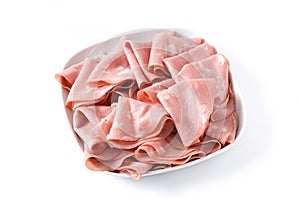 Mortadella slices on white plate isolated