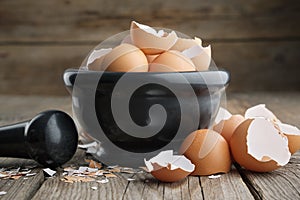 Mortar of eggshell. Shell of eggs on wooden kitchen table