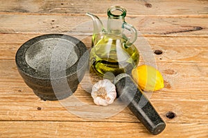 Mortar and pestle with alioli ingredients