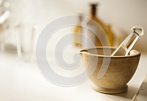 Mortar and pestle with drug vial and bottles