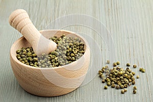 Mortar and pestle with green pepper