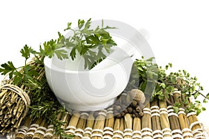 Mortar and pestle with herbs photo