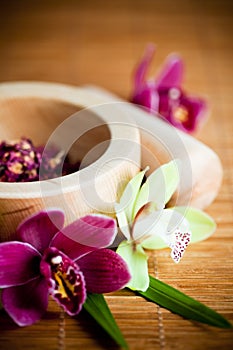 Mortar and pestle with orchids photo