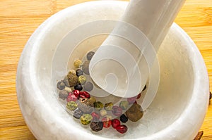 mortar and pestle with peppercorn mix