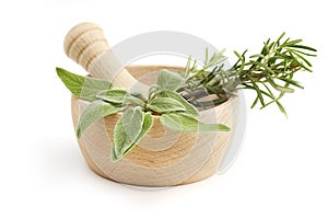 Mortar and pestle with sage and rosemary