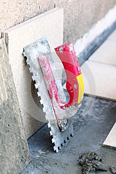 Mortar on wall construction notched trowel