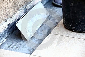 Mortar on wall construction notched trowel