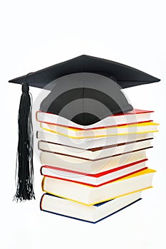 Mortarboard on a book stack