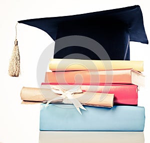 Mortarboard and graduation scroll