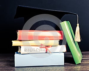 A mortarboard and graduation scroll