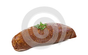 Morteau sausages wirg parsley in front of white background