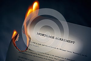 Mortgage Agreement Contract Burning On Fire