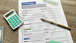 Mortgage application form on a wooden table.