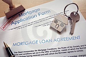Mortgage application loan agreement and house key