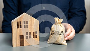 Mortgage borrowers concept. Individuals or entities who have taken out a mortgage loan from a lender to finance the purchase of a photo