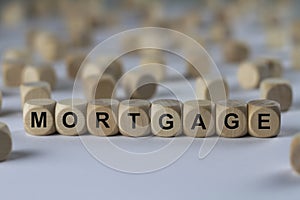 Mortgage - cube with letters, sign with wooden cubes