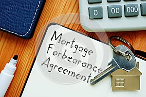 Mortgage Forbearance Agreement is shown on the conceptual business photo