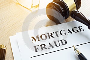 Mortgage fraud evidences on a desk. photo
