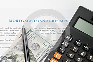 Mortgage loan agreement sign contract concept, pen on US dollar